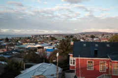 Views across the Chilean city of Punta Arenas, the ocean can be seen in the distance.