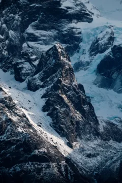 A close up of granite peaks covered in thick ice, Torres del Paine National Park, Chile.