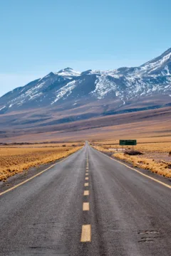 Chilean highway leading to a backdrop of mountains.