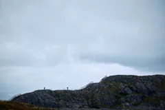 Rocky hills of Brimstone Head walking trail are backed by cloudy skies.