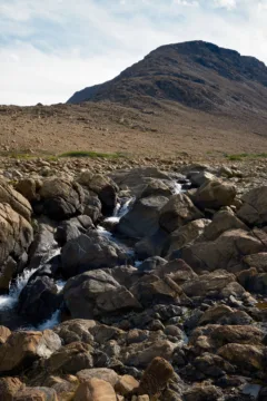 Rocks and muddy hillside in Tablelands, Gros Morne National Park.