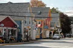 A street of colourful wooden shops in small town Canada.