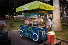 A food stand selling Picarones (Peruvian doughnuts).