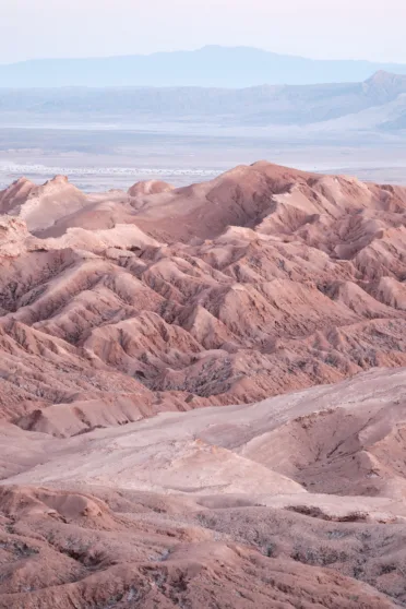 A photo of the unusual red rock formations that make up the Valley of the Moon in Chile.