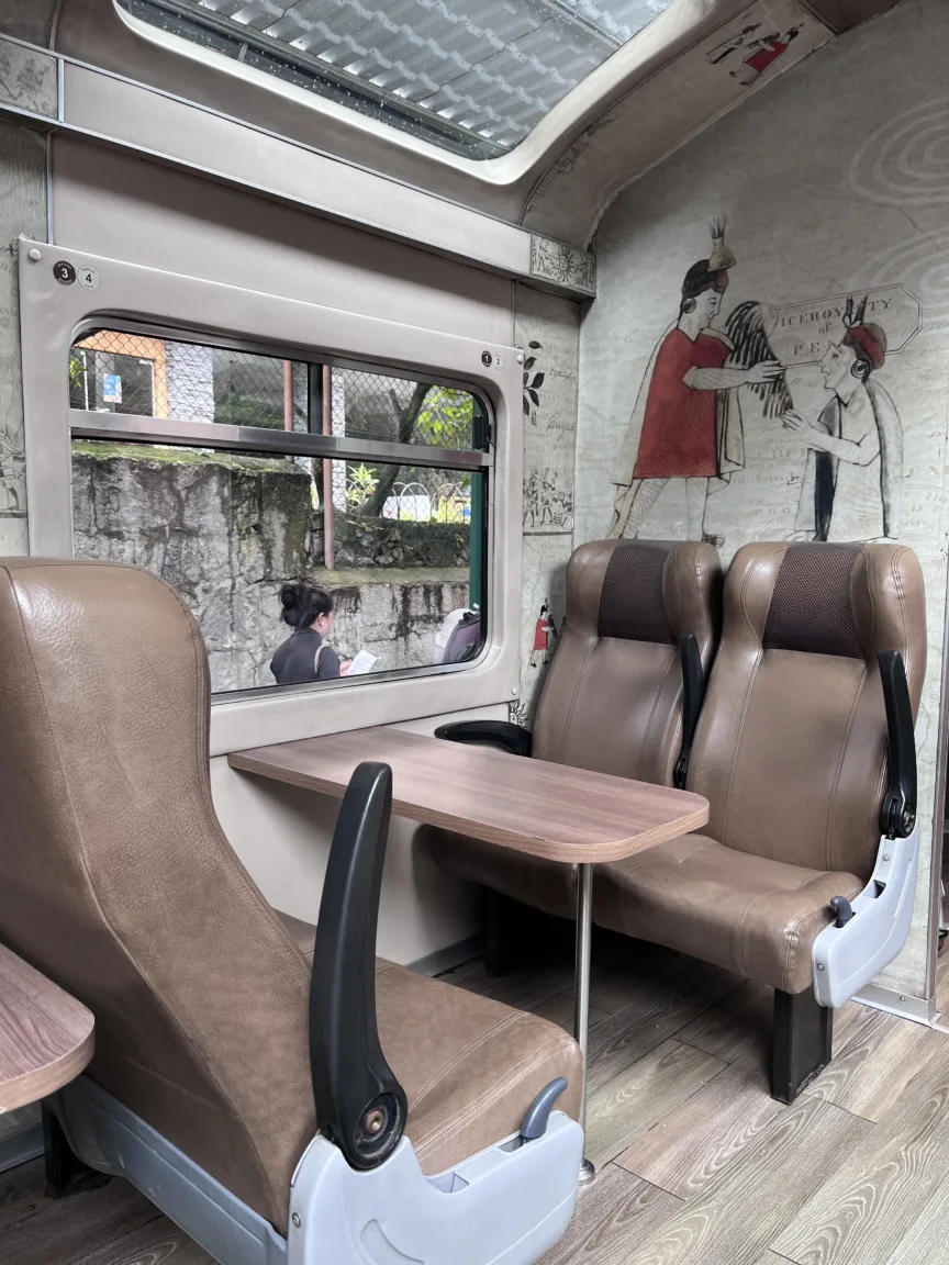 The interior of a PeruRail Expedition train carriage.