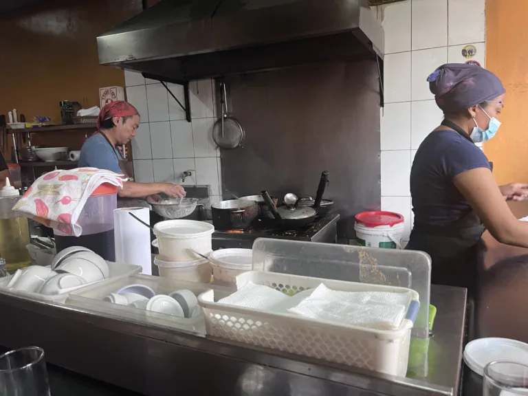 A chef cooking in a Peruvian restaurant.