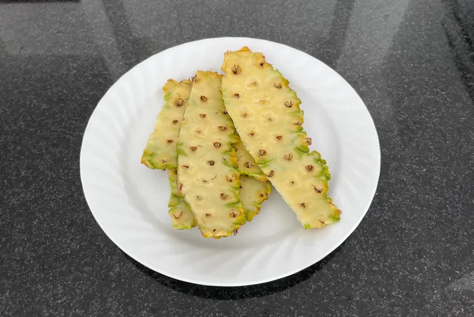 Slices of pineapple skin on a white plate.